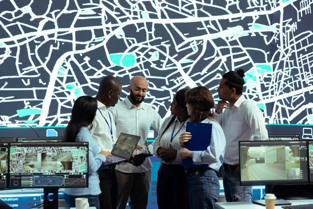 Group of professionals discussing AI-driven tools for reputation management in front of a digital map display, enhancing local visibility and Google Business Profile optimization.