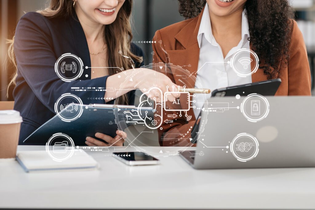 Two women collaborating with digital devices, showcasing AI technology and online review management concepts, enhancing local SEO and business growth.