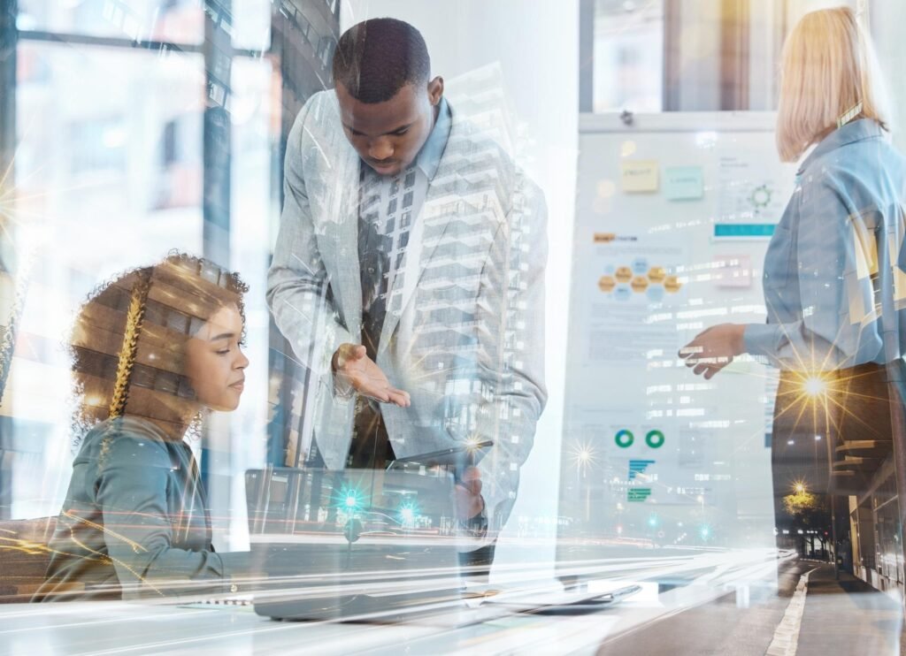 Business professionals collaborating in a modern office, discussing AI-driven marketing strategies for local business growth, with visuals of city lights and digital data overlays.